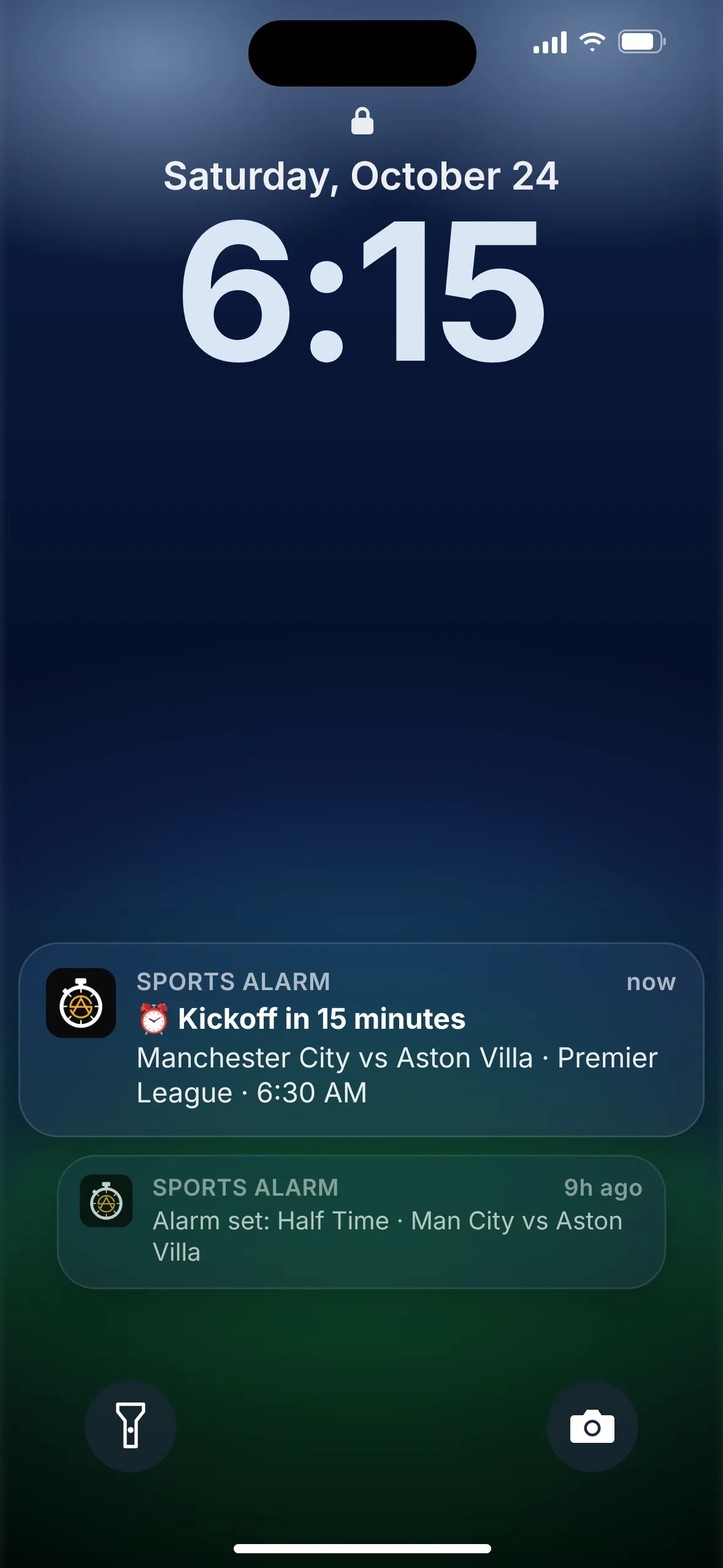 A phone lock screen showing a Premier League kickoff alarm