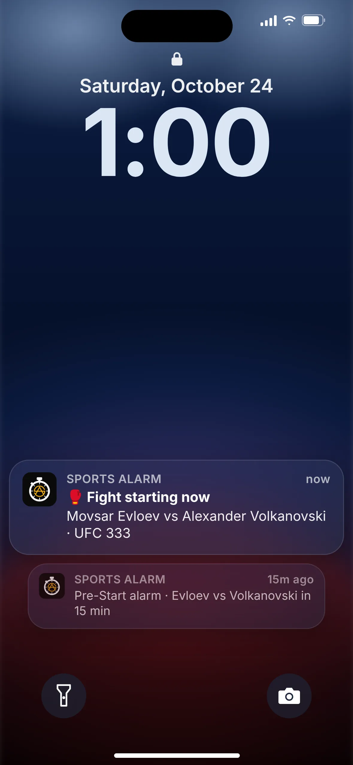 A phone lock screen showing a UFC fight alarm